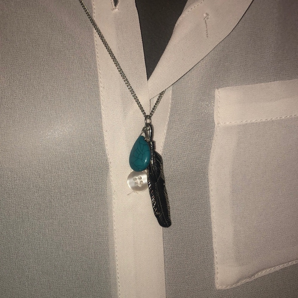 Silver necklace with silver leaf and blue pendant